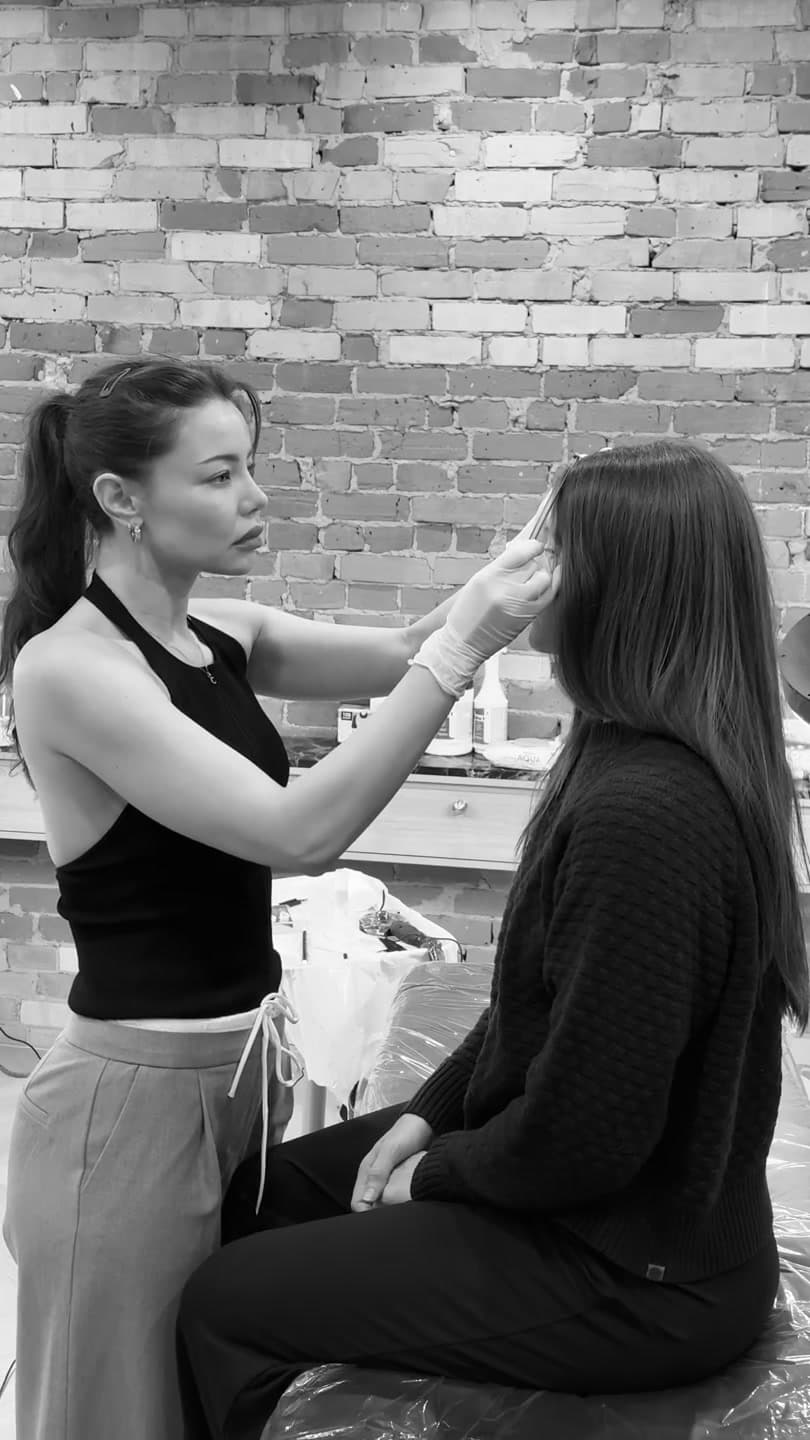 Catherine focused on a client in her studio